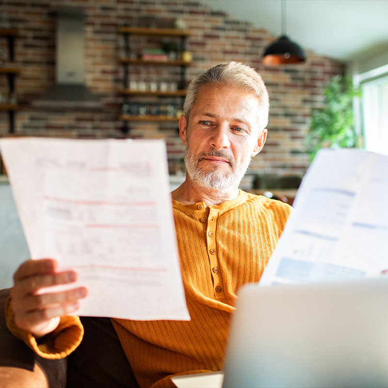 man studying retirement withdrawal options Moore Invested