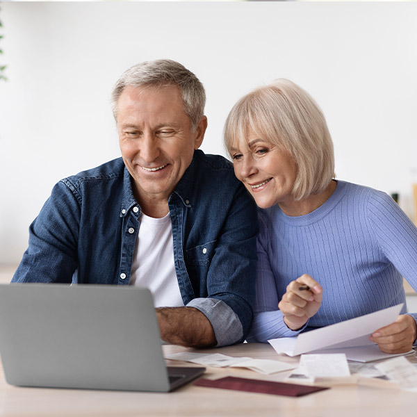 retired couple pondering income streams with Moore Invested